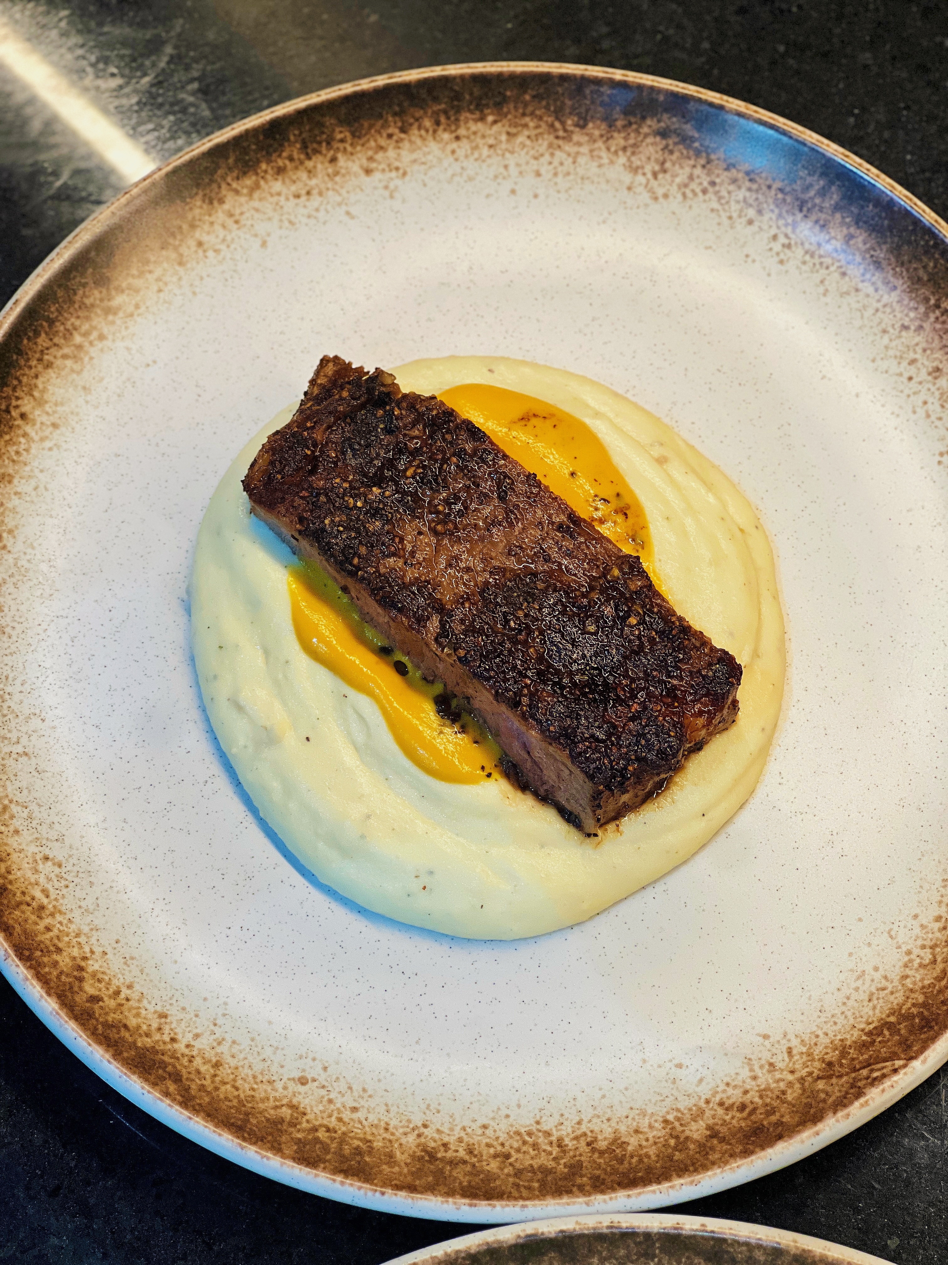 Spiced beef on creamy mash with squash purée